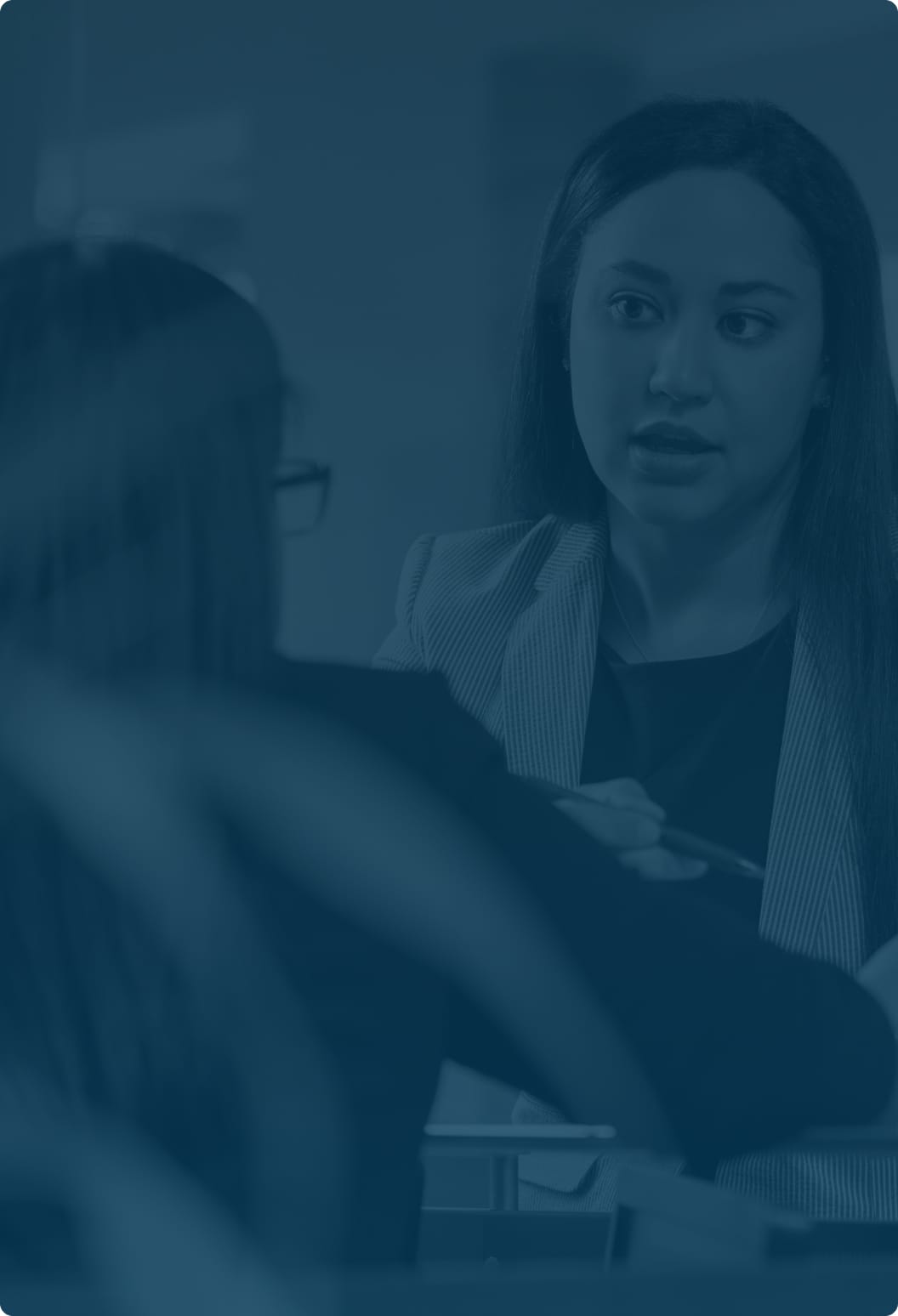 Woman speaking to Michelle Y. Gurian